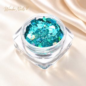 Glitter Mix Irizáló Tengertürkiz 27. csillámkeverék nyitott tégelyben, világos háttéren