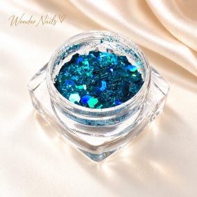 Glitter Mix irizáló petrolkék 43. – nyitott tégelyben, champagne szatén háttéren